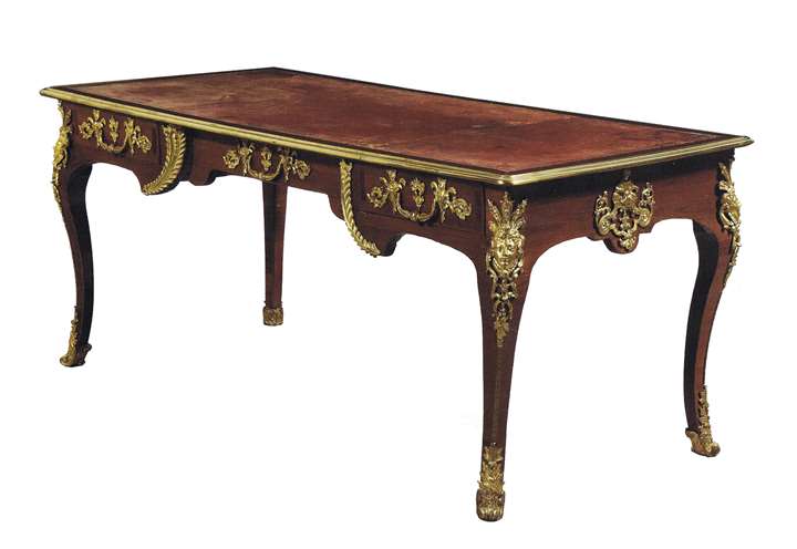A Régence ormolu-mounted amaranth
Bureau Plat stamped by Noël Gérard